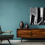 Black and White Mdina alley canvas above a wooden sidetable with blue green wall and an blue green armchair