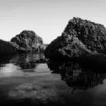 black and white photo of the maltese coastline from Ghar Lapsi with rock reflections on seawater