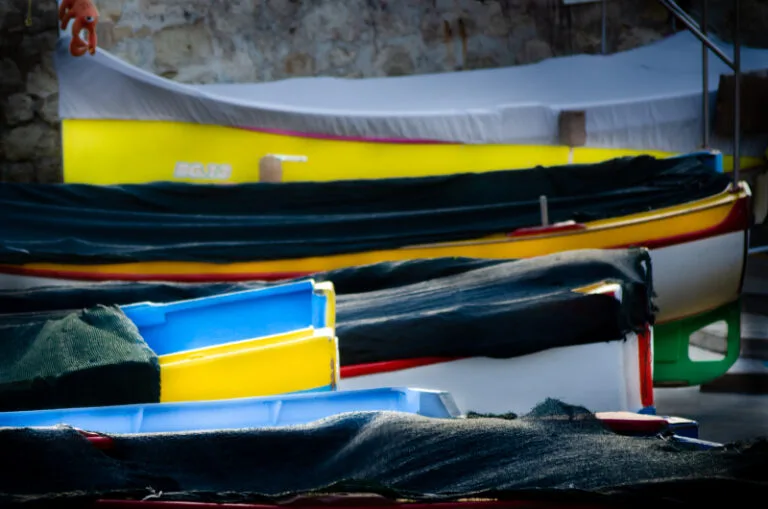 Closeup of the handrail on a traditional wooden Maltese fishing boat