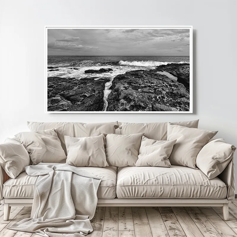 Malta Canvas Print | Malta Coastline in black and white hanged above a white sofa