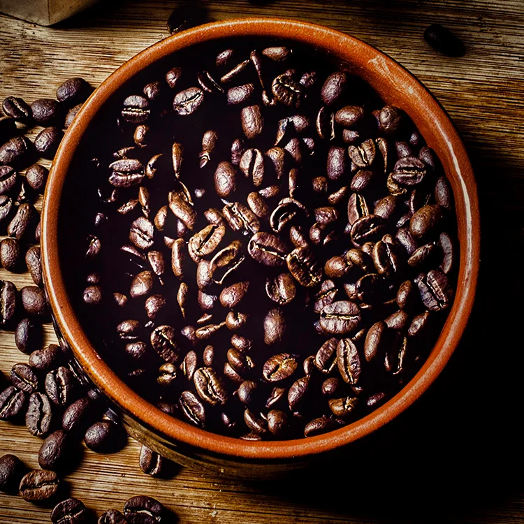 top view of a bowl filled with coffee beans