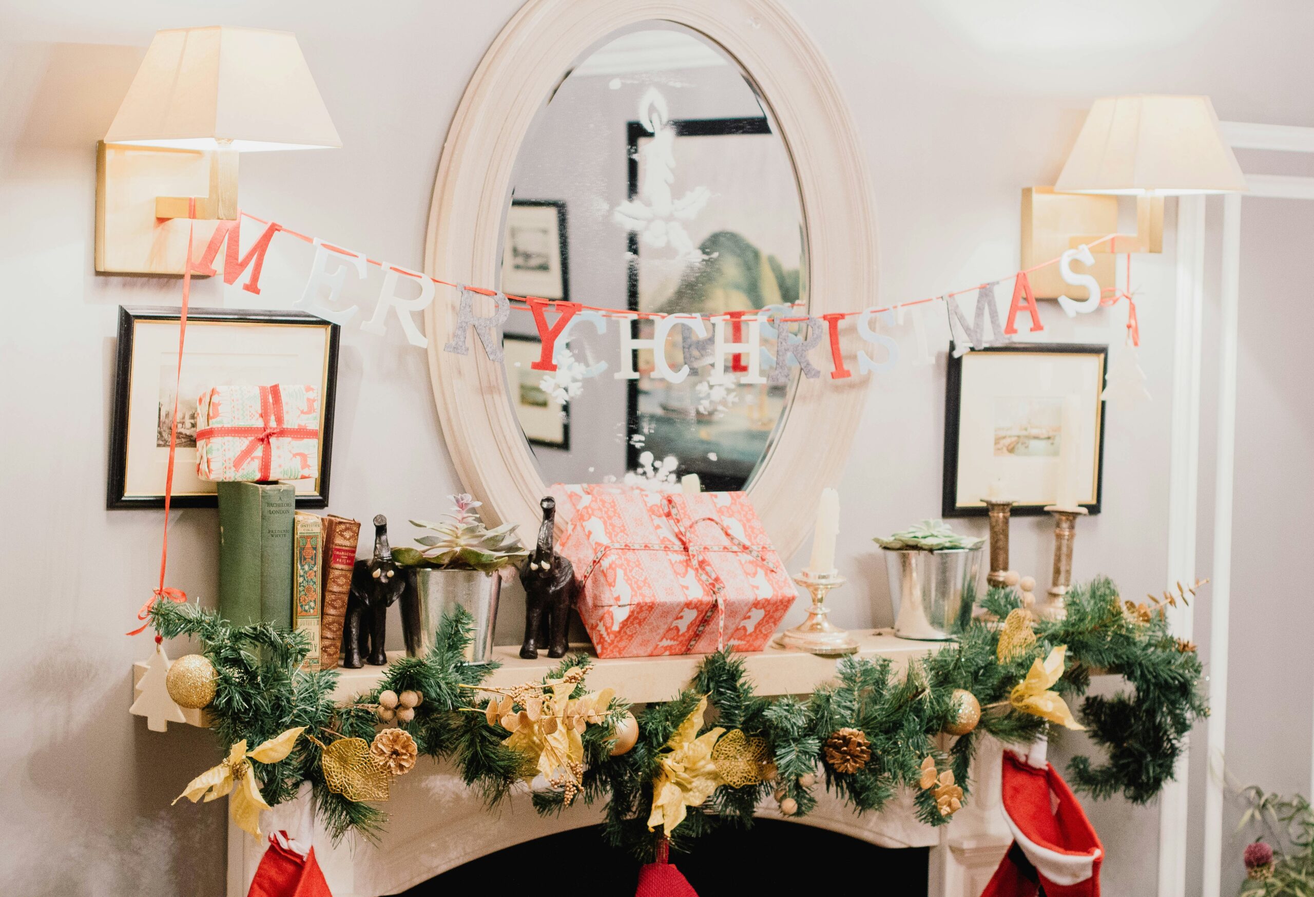 A festive fireplace mantel adorned with colorful stockings and cheerful Christmas decorations, creating a warm holiday atmosphere