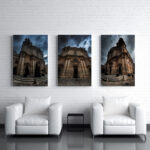 2 white sofas with a hanging 3 canvas set of Mdina Cathedral