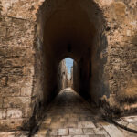 An ancient archway in Mdina, showcasing the timeless charm of the city's historic streets