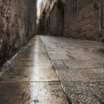 A charming narrow street in Mdina, with a historic building in the background, epitomizing the timeless allure of the streets.