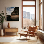 comfortable chair positioned next to a framed print of the Gozo Qbajjar in a well-decorated living room, enhancing the space's charm.