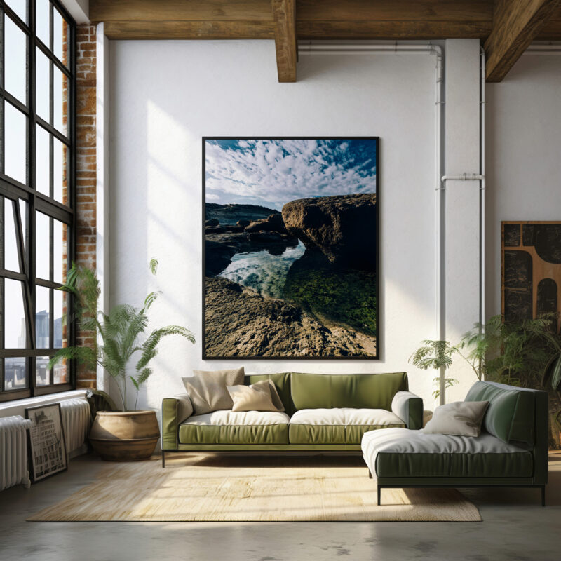 A sizeable artwork about the Gozo Qbajjar Coast adorns the wall above a couch, contributing to the inviting atmosphere of the living room.