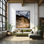 A large framed photo of a desert landscape at Gozo Qbajjar, displayed prominently in a stylish living room setting