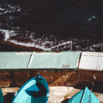 A collection of small boats on the shore in Valletta, highlighting the charm of the seaside landscape.