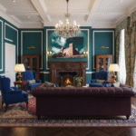 A St. Agatha Red Tower Rise is displayed on a kitchen counter in a modern home, with a vase of flowers and a bowl of fruit beside it.
