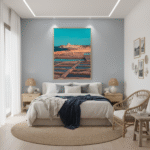 A person in a straw hat walks along the ancient Xwejni Salt Pans in Gozo, with the Mediterranean Sea in the background under a clear blue sky, suggesting a serene and historic travel experience.