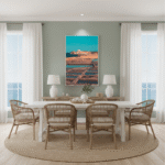 A person walks along the edge of the Xwejni Salt Pans, with the hexagonal salt pans visible in the foreground and the Mediterranean Sea in the background under a clear blue sky.