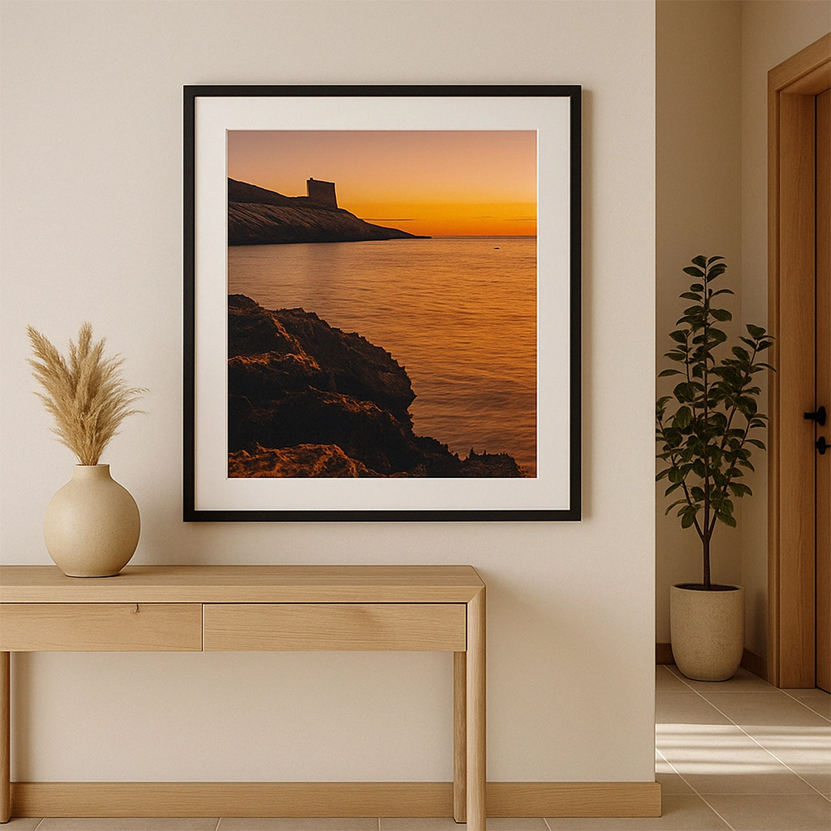 Framed sunset seascape with Xlendi Tower above calm sea in hallway