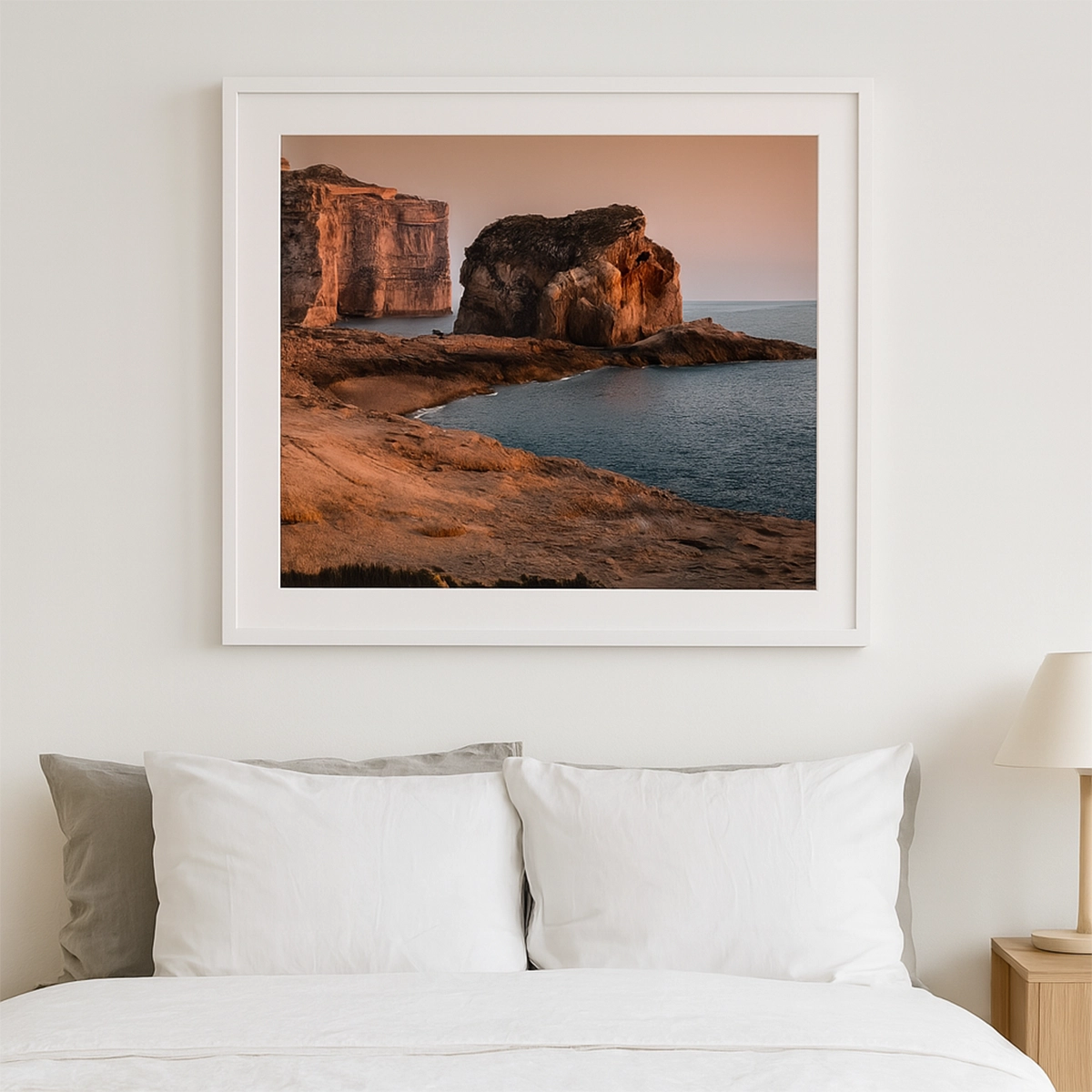 Sunset over rocky coastline and Fungus Rock in Gozo Malta