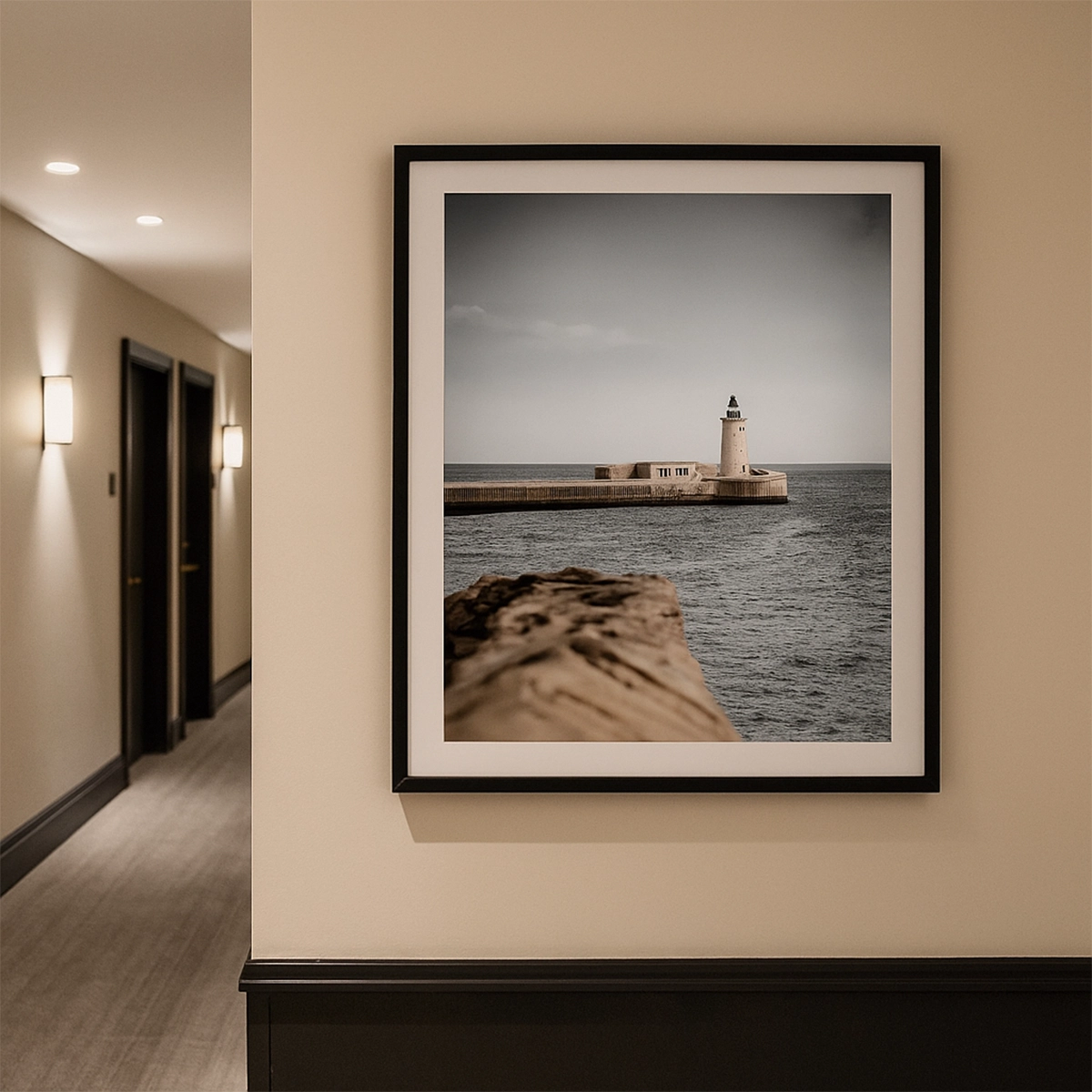 Framed lighthouse photograph on beige wall of modern hallway with doors