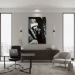 A person gazes through a limestone archway, framed by wild bushes and the ancient, weathered walls of the Citadel in Gozo, Malta, with the deep blue Mediterranean Sea visible in the distance under a clear sky.