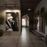 A person walks through the Citadel Gozo Arches, highlighting their grand scale and historical beauty.