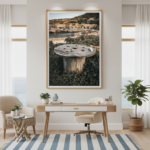 A Gozo Dahlet Qorrot Wooden Spool sitting on a rustic outdoor table with a blurred background of a sunny Mediterranean landscape, suggesting a relaxed, artisanal lifestyle.