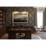 Monochromatic photo of Gozo Ta Gurdan Lighthouse art print displayed in a modern, minimalist living room with a person reading on a sofa, and sunlight streaming through a window.