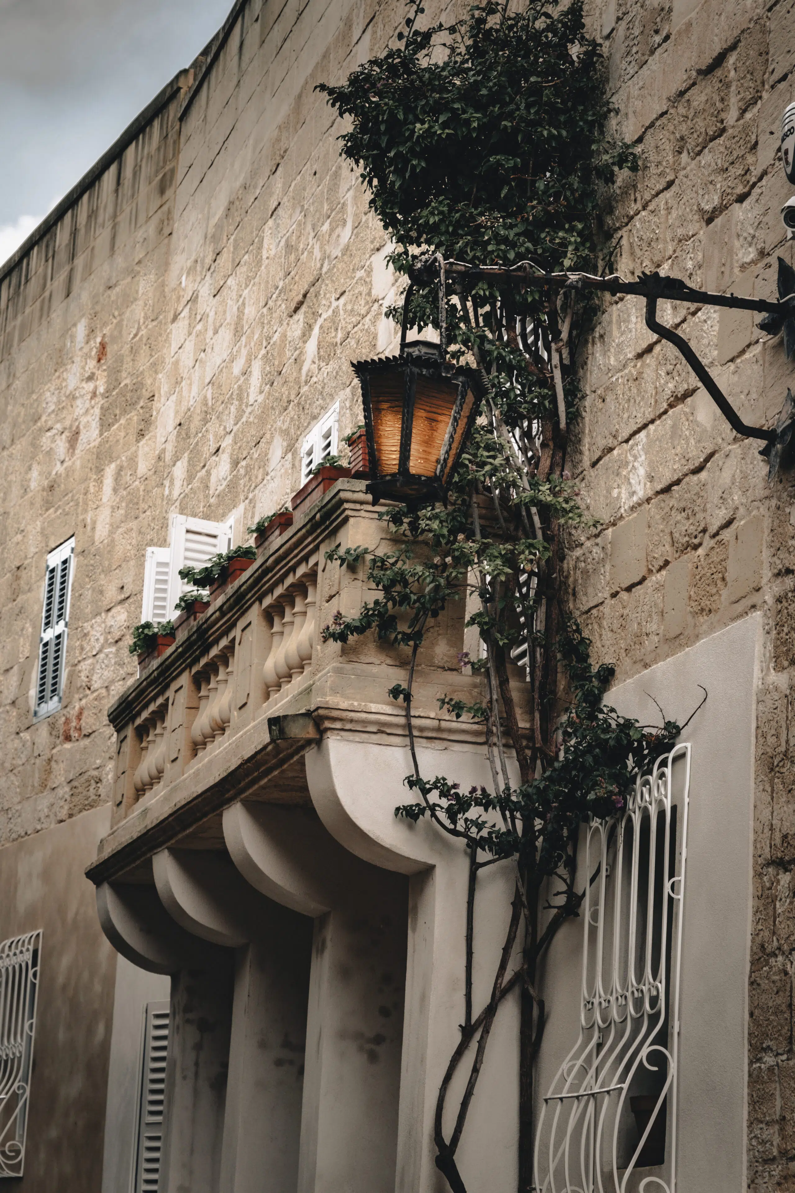 Malta Mdina Stone balcony with lantern and climbing ivy