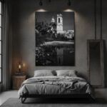 An elegant, modern living room with a large window overlooking a city. A framed print of the Malta Mtahleb Church Reflection hangs on the wall above a minimalist sofa, adding a serene focal point to the contemporary space.