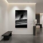 A serene living room with a large window overlooking a garden, featuring the "Mgarr Malta Church Blocks" wall art prominently displayed above a modern minimalist sofa, suggesting a calm and stylish home environment.