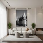 A lifestyle image of the "Rabat Malta Vjal Santu Wistin" wall art hanging in a modern living room above a sofa with natural light coming in from a window.
