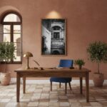 A chic living room with a Malta Mdina Arch Balcony canvas print hanging above a minimalist sofa, bathed in natural light.