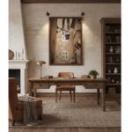 A beautifully lit, narrow pedestrian lane in Mdina, Malta at dusk. Lanterns cast a warm glow on the ancient stone buildings and arched passages, with one lantern prominently featuring the "Malta Mdina Lantern Lane" wall art hanging on the wall.