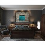 A living room with a turquoise wall art piece featuring the Malta Mdina arch. A cozy rug, a houseplant, and natural light complete the scene.