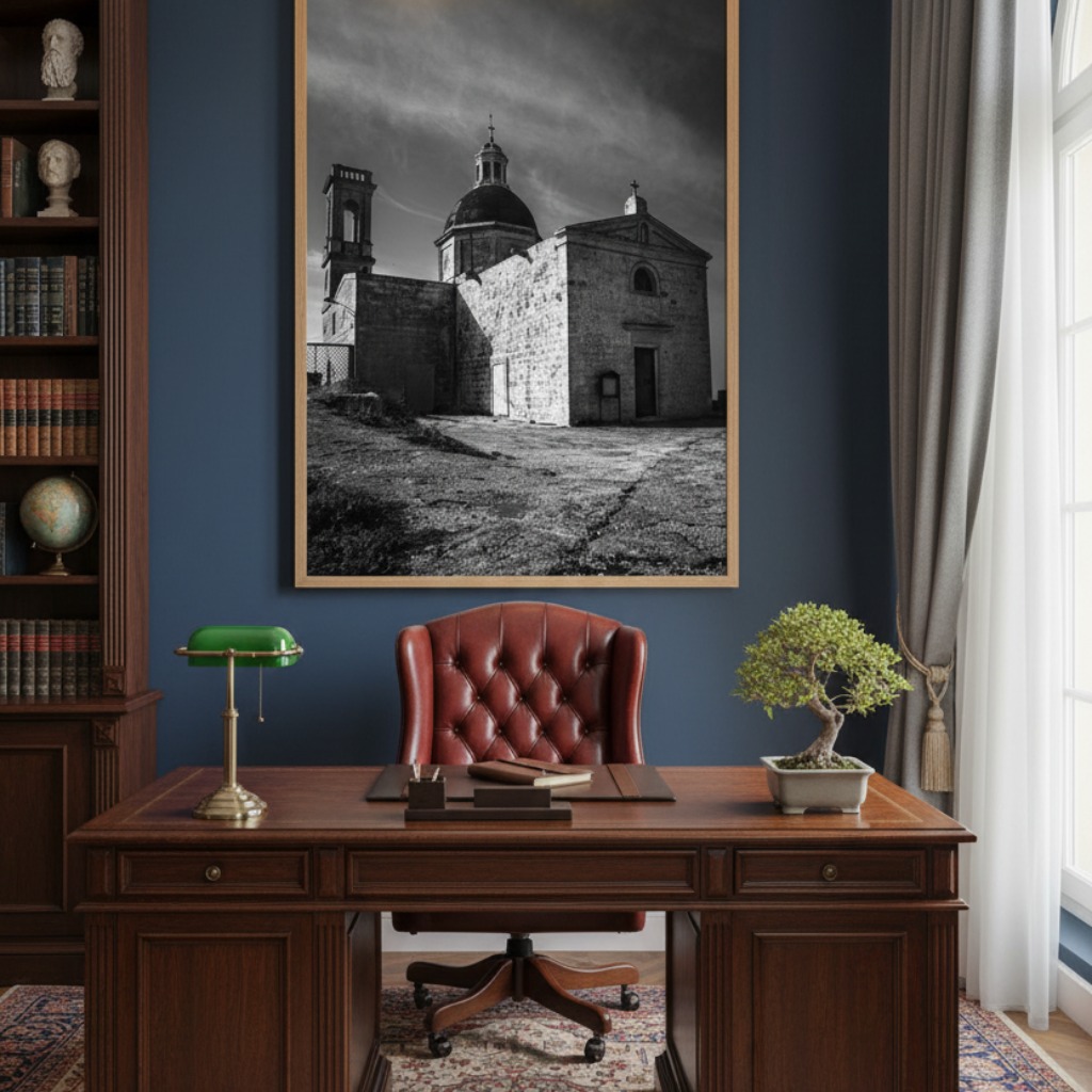 A stunning view of the Mediterranean Sea from a modern living room, with a large framed print of Malta Mtahleb Church on the wall above a minimalist sofa.