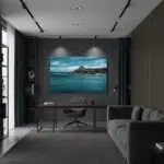 Gozo Qbajjar Qolla l-bajda Blue Hour artwork displayed in a modern living room with a person relaxing on a sofa, reading a book, and a warm lamp illuminating the space.