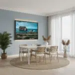 A person admiring the Gozo Dwejra Fungus Rock Blue Hour print, displayed in a modern living room with a cozy ambiance.