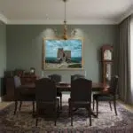 Gozo Dwejra Tower Blue Hour mockup #4 in a lifestyle setting, with the tower visible on a table next to a cup of coffee and a book, suggesting a calm morning or evening scene.