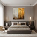 A stylish living room featuring a "Dusk Gold Fusion Abstract" print above a minimalist sofa, with a potted plant and natural light creating a serene, inviting atmosphere.