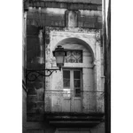 Old stone balcony with wrought iron railing