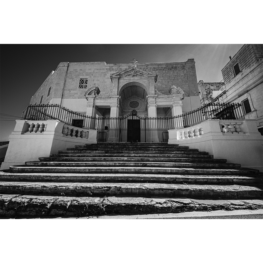 Black and white photo of historic stone church