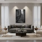 Modern living room with black-and-white staircase artwork