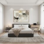 Modern minimalist bedroom with gray bed and abstract art