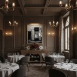 Elegant restaurant dining room with chandeliers and round tables