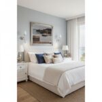 Coastal bedroom with ocean view and white bedding