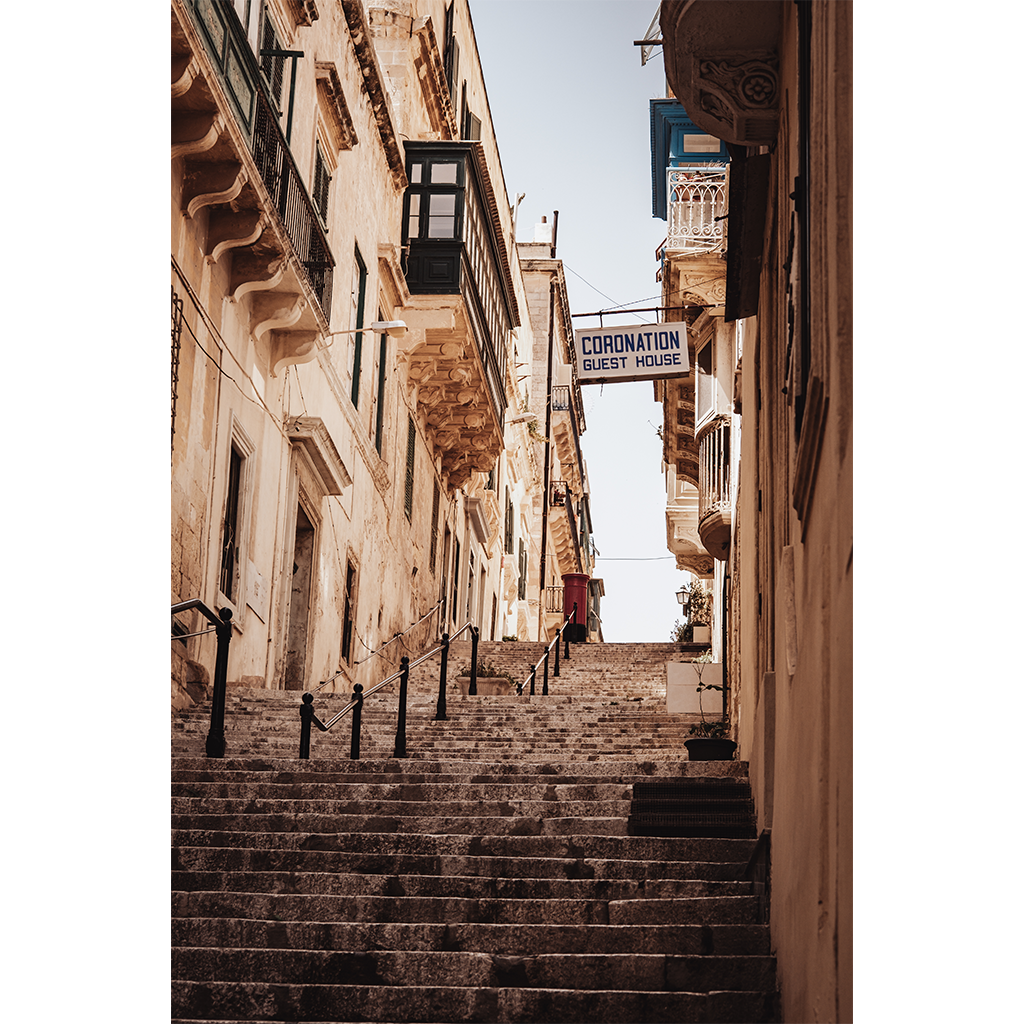 Narrow stone staircase between historic European buildings