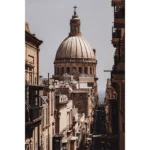 Domed cathedral at end of narrow city street