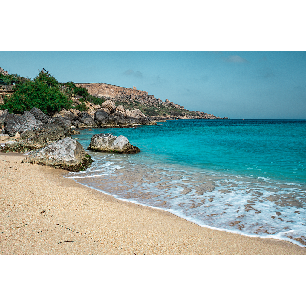 Rocky coastline with turquoise water and sandy beach