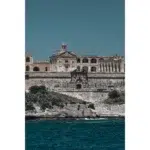 Historic stone fortress overlooking turquoise sea