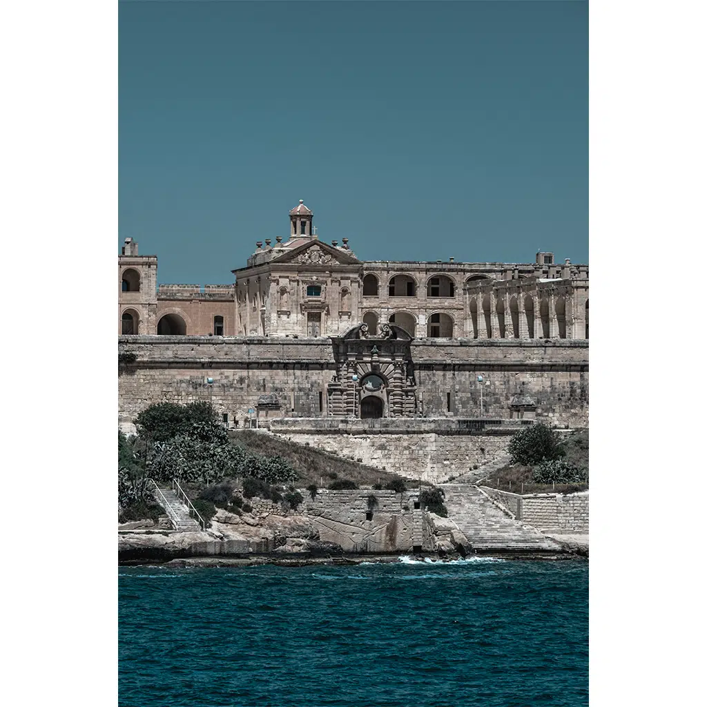 Historic stone fortress overlooking turquoise sea