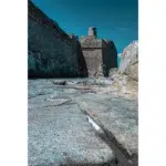 Ancient stone fortress walls under clear blue sky