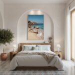 Mediterranean bedroom with beach artwork above bed