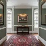 Elegant hallway with stained glass windows and rug