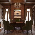 Elegant traditional office with chandelier and green chairs